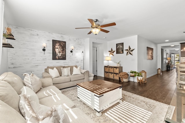 living room featuring ceiling fan and hardwood / wood-style flooring