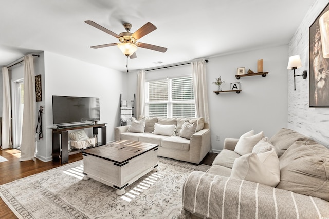 living room with ceiling fan and hardwood / wood-style floors