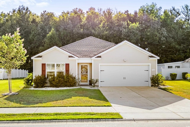 view of front of home featuring a front yard and a garage