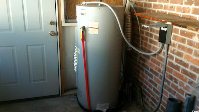 utility room with gas water heater