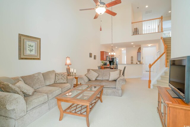 206 Mossy Stone Ct Unit 1605, Murrells Inlet, SC 29576 - living room with ceiling fan, stairway, a high ceiling, light carpet, and a chandelier