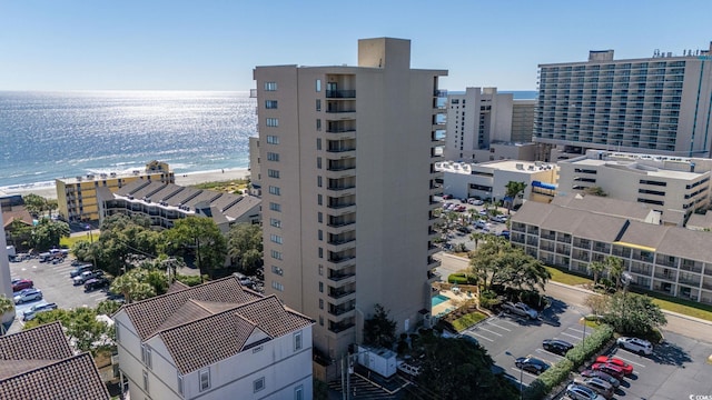 bird's eye view with a water view and a view of the beach