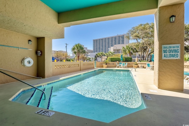 view of pool with a patio