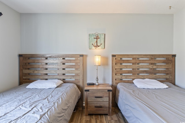 bedroom with hardwood / wood-style floors