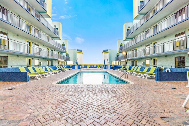 view of pool featuring a patio