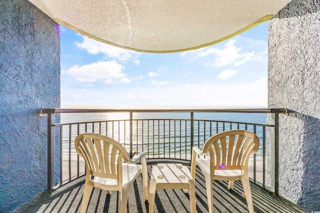 balcony featuring a water view