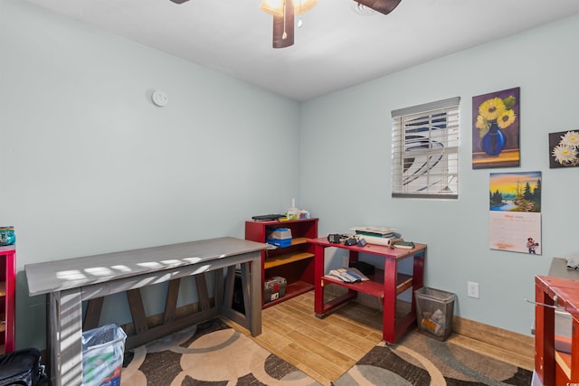 recreation room featuring ceiling fan and hardwood / wood-style flooring