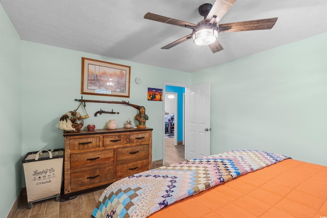 bedroom with light wood-type flooring and ceiling fan