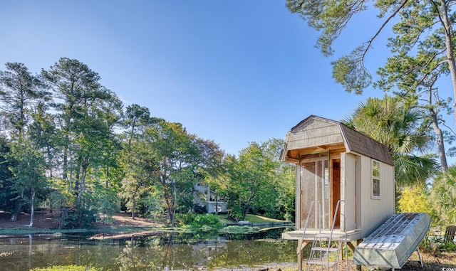 view of outbuilding featuring a water view