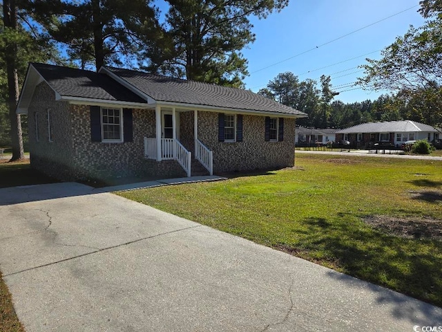 single story home with a front yard and a porch