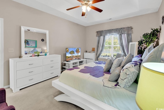 bedroom with light colored carpet and ceiling fan