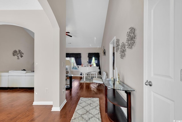 entryway with ceiling fan, lofted ceiling, and dark hardwood / wood-style floors