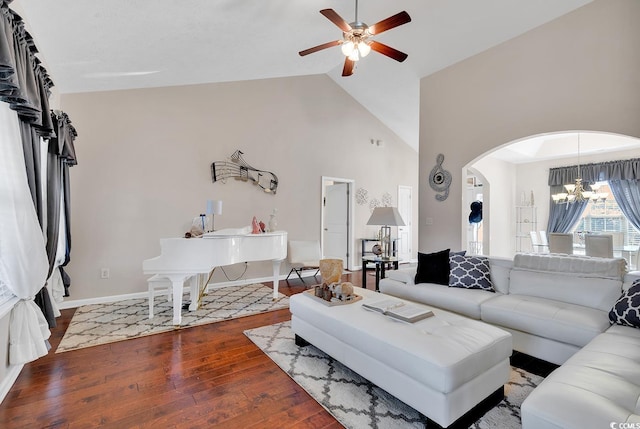 living room featuring high vaulted ceiling, hardwood / wood-style flooring, and ceiling fan with notable chandelier