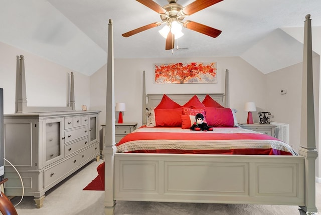 bedroom with ceiling fan, lofted ceiling, and light colored carpet