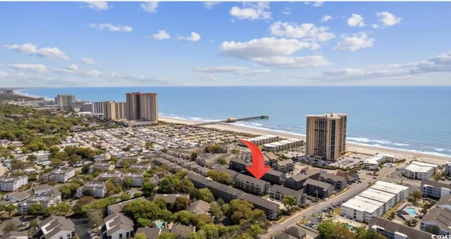 birds eye view of property featuring a view of the beach and a water view