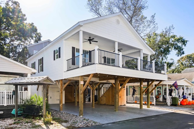 view of front of home featuring a carport and ceiling fan