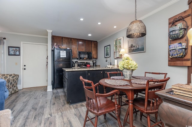 118 Salt Marsh Cir Unit 25-I, Pawleys Island, SC 29585 - dining space with light wood finished floors, crown molding, and recessed lighting