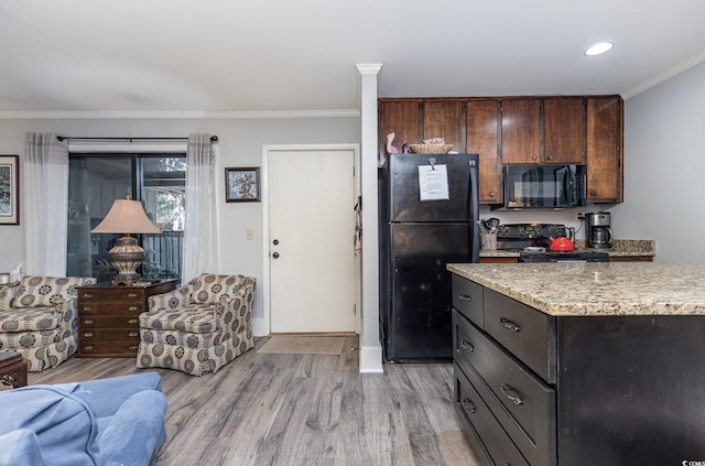 118 Salt Marsh Cir Unit 25-I, Pawleys Island, SC 29585 - kitchen featuring black appliances, light wood finished floors, crown molding, light stone countertops, and baseboards
