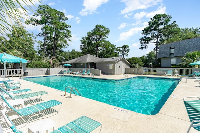 118 Salt Marsh Cir Unit 25-I, Pawleys Island, SC 29585 - community pool with a patio area and view of scattered trees