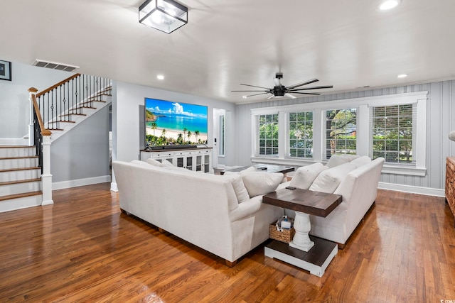 living room featuring ceiling fan and wood-type flooring