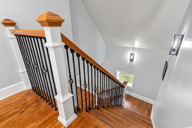 stairway featuring hardwood / wood-style flooring