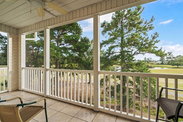 sunroom / solarium with ceiling fan and wood ceiling