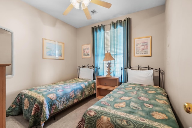 carpeted bedroom with multiple windows and ceiling fan