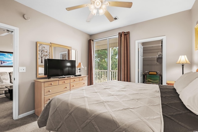 bedroom featuring ceiling fan, access to outside, a spacious closet, carpet floors, and a closet