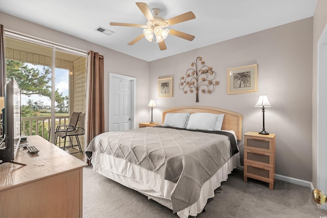 bedroom featuring ceiling fan, dark colored carpet, and access to exterior