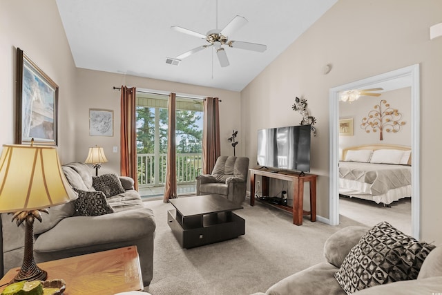 carpeted living room with high vaulted ceiling and ceiling fan