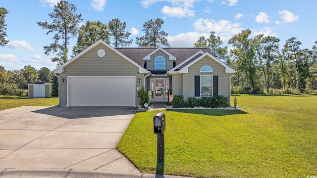 view of front of home with a garage and a front lawn