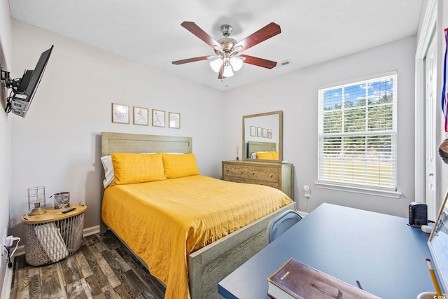 bedroom with dark wood-type flooring and ceiling fan