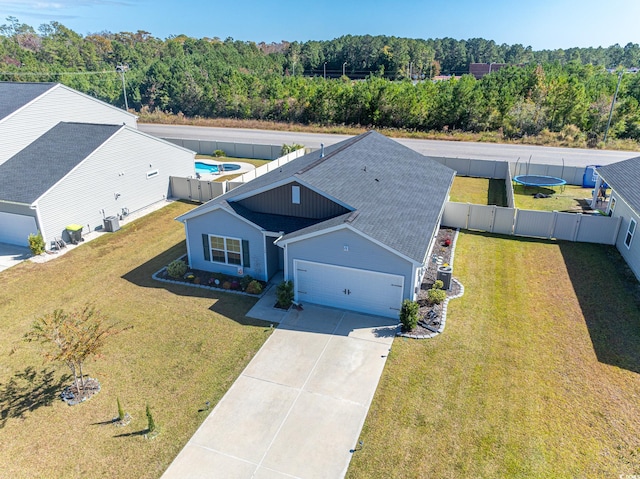 birds eye view of property with a forest view