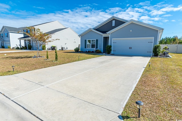 view of front facade with a front yard and a garage