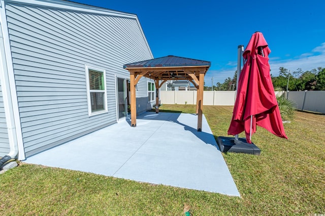 view of patio with a gazebo and a fenced backyard