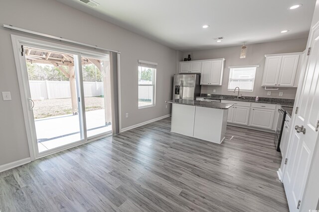 living room with light wood-type flooring and ceiling fan