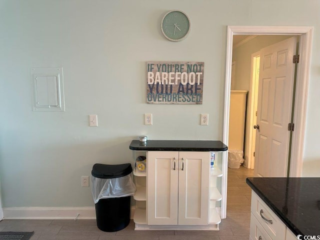 interior space with vanity and crown molding