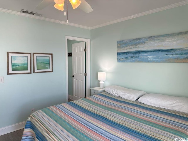 bedroom featuring hardwood / wood-style flooring, ceiling fan, and crown molding