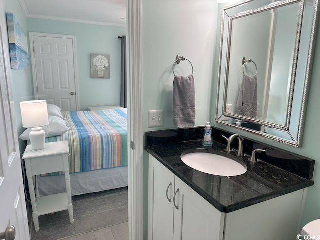 bathroom featuring vanity and ornamental molding