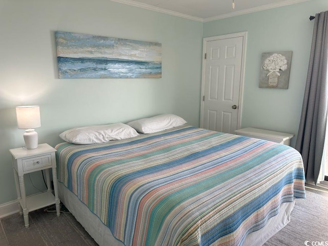 bedroom with ornamental molding and dark wood-type flooring