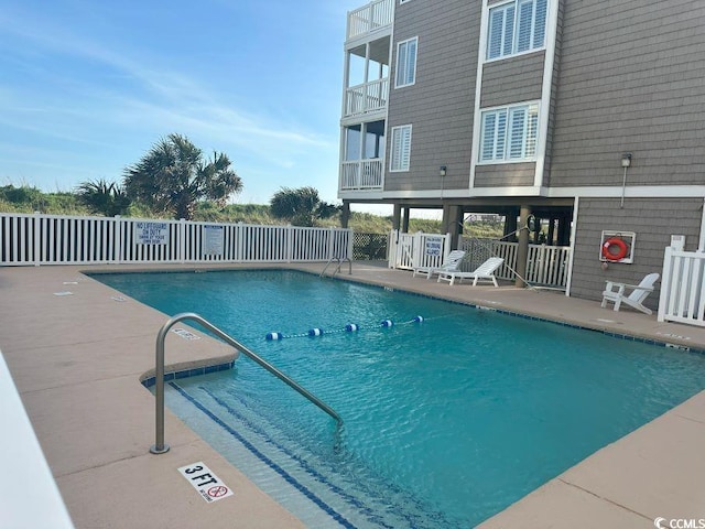 view of pool featuring a patio