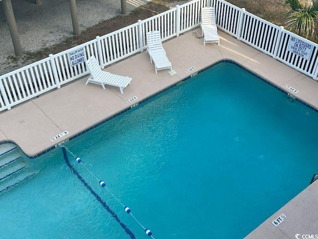 view of pool featuring a patio