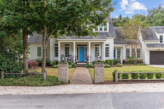 view of front facade with a porch and a front yard