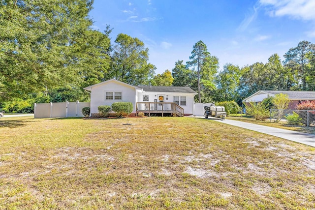 1412 Hemingway St, Myrtle Beach, SC 29577 - view of front of property with a front yard, a deck, and fence