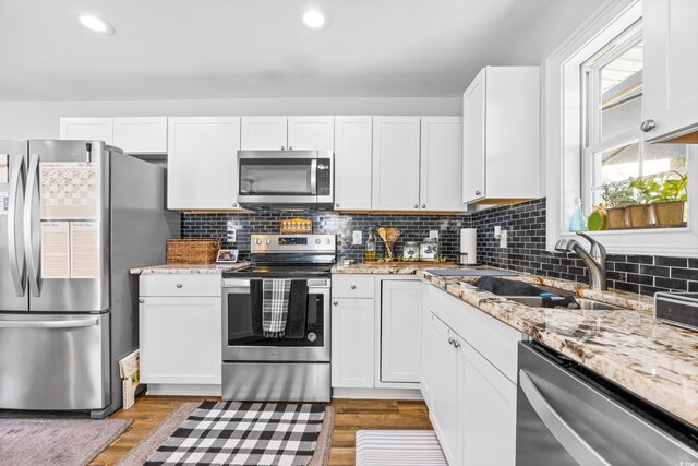 kitchen with white cabinets and stainless steel appliances