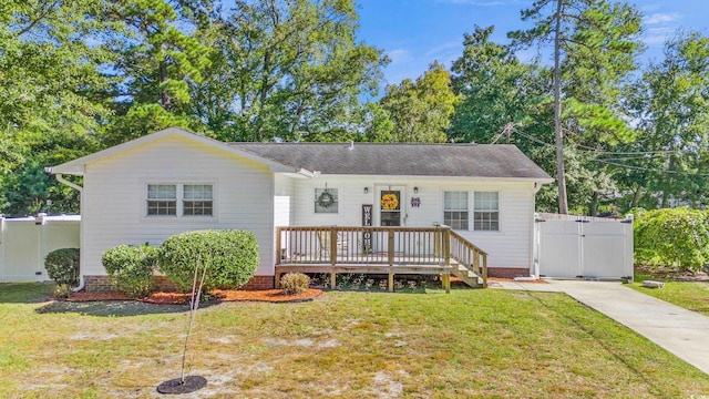 1412 Hemingway St, Myrtle Beach, SC 29577 - single story home with a front lawn, a wooden deck, fence, and a gate