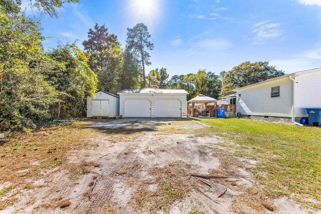 garage with a yard