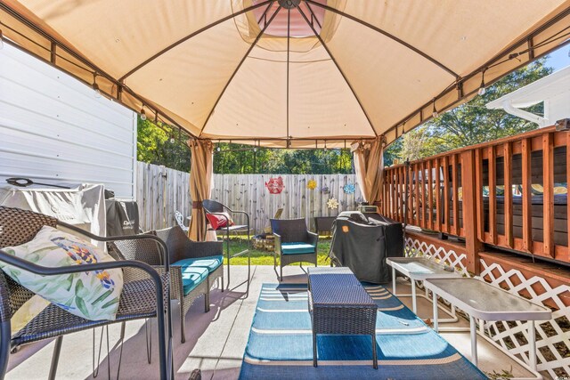 view of patio / terrace with a gazebo and an outdoor living space