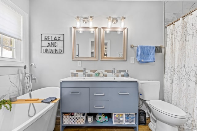 1412 Hemingway St, Myrtle Beach, SC 29577 - bathroom featuring a freestanding bath, toilet, a shower with curtain, and double vanity