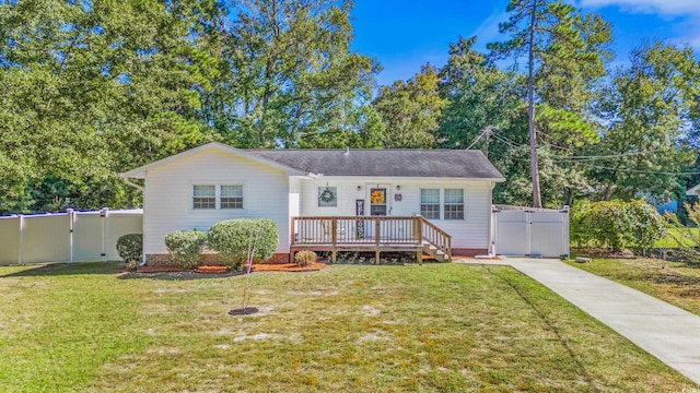 1412 Hemingway St, Myrtle Beach, SC 29577 - view of front of house with a gate, concrete driveway, a front yard, and a deck